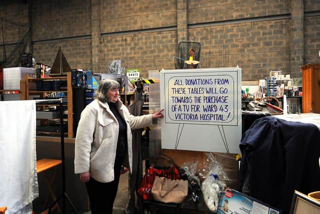 Jean at the stall raising money to buy a television for Victoria Hospital's ward 43. Pic: Fife Photo Agency.