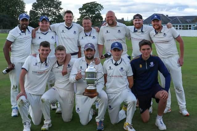 The victorious Falkland side with their trophy. Picture by David Potter