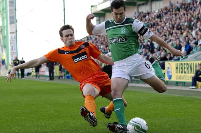 Ian Murray playing for Hibs against Dundee United in September 2011, being tackled by his current Raith Rovers centre back Keith Watson (Pic Bill Murray/SNS Group)