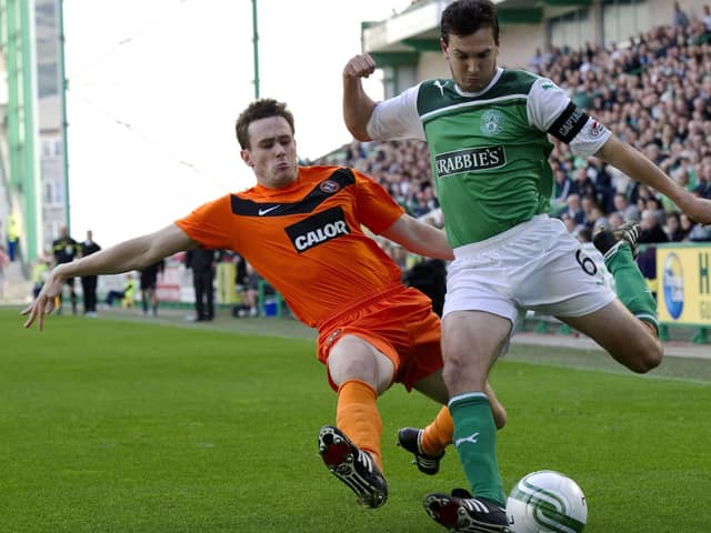 Ian Murray playing for Hibs against Dundee United in September 2011, being tackled by his current Raith Rovers centre back Keith Watson (Pic Bill Murray/SNS Group)