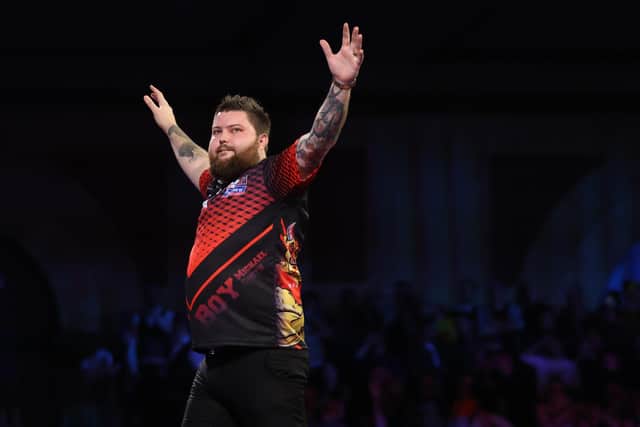 Michael Smith of England reacts during his Quarter-Finals Match against Gerwyn Price at the William Hill World Darts Championship at Alexandra Palace (Photo by Luke Walker/Getty Images)
