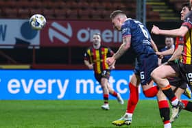 Raith Rovers' Euan Murray heads in the winner during Tuesday night's 1-0 victory at Partick Thistle (Pics by Ross MacDonald/SNS Group)