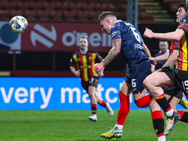 Raith Rovers' Euan Murray heads in the winner during Tuesday night's 1-0 victory at Partick Thistle (Pics by Ross MacDonald/SNS Group)