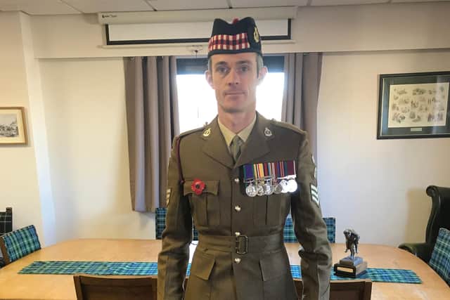 Staff Sergeant Jamie Ferguson proudly displaying his medals.