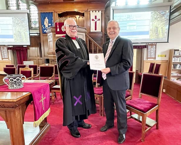 Ian Ogilvie receives his long service award from the Rev Graham Deans (Pic: Submitted)