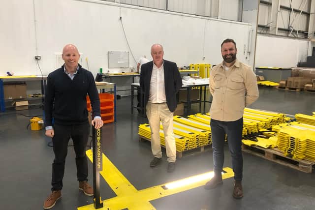 The Powertrack team, from left to right, Gareth Careys, Keith Gordon, and Chris Kerr next to their revolutionary product.