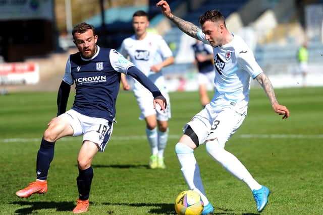 MacDonald is challenged by  Dundee's Paul McMullan (Pic: Fife Photo Agency)