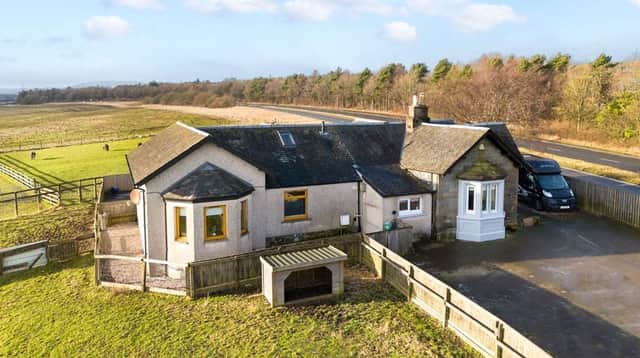 The detached listed lodge house with excellent equestrian facilities is set within 2.25 acres.