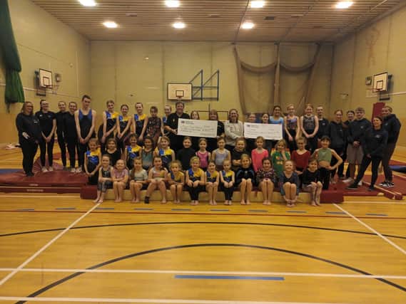 Members of Kirkcaldy Gymnastics Club raised almost £1200 to be shared between two charities - CHAS and Paige's Musical Butterflies.