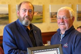 David Joy (left) receives the framed honorary membership certificate from club captain, Barrie Liddle.