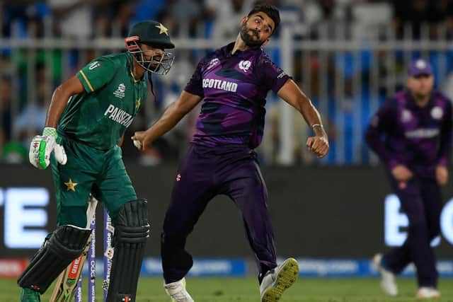 Scotland's Safyaan Sharif delivers a ball during the ICC mens Twenty20 World Cup cricket match between Pakistan and Scotland. Photo by Aamir Qureshi/AFP via Getty Images