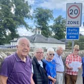Residents in Cupar's Brighton Road hand a petition to Councillor Stefan Hogan-Radu calling for the speed limit to be reduced from 30mph to 20mph along the full length of the road.  (Pic: submitted)