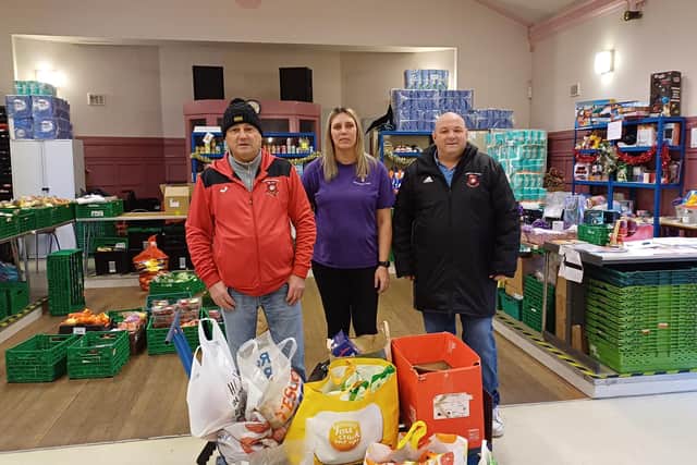 Margaret King, from the Bowhill Centre, accepts a donation of food parcels for The Fridge from Bowhill Rovers secretary Brian Penman (left) and committee member Gordon Hindley.  (pic: submitted)