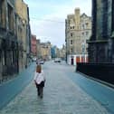 It's Spring 2020, and Edinburgh fell silent as tourists stayed away - a once in a lifetime view of the empty cobbled road leading from the castle to the Royal Mile.