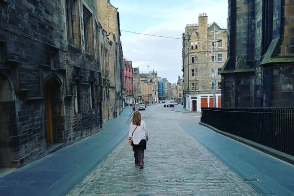 It's Spring 2020, and Edinburgh fell silent as tourists stayed away - a once in a lifetime view of the empty cobbled road leading from the castle to the Royal Mile.