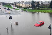 A car trapped due to heavy flooding in Granton, Edinburgh. Picture: John Devlin