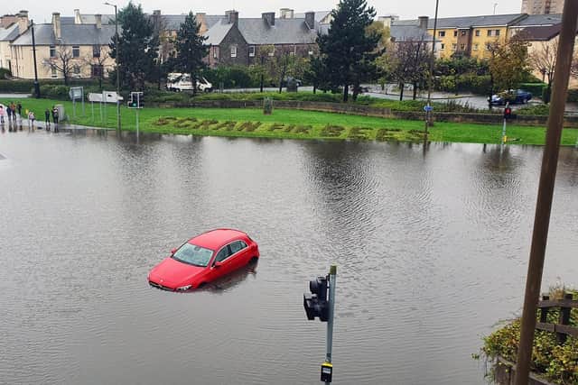 A car trapped due to heavy flooding in Granton, Edinburgh. Picture: John Devlin