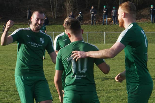 Robbie Westwaters (number10) is congratulated after scoring Thornton Hibs' second goal at Ormiston Primrose