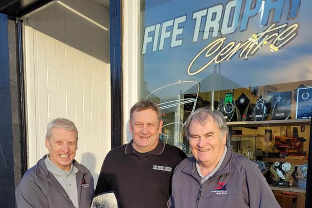 George Macdonald and Don Burns from Kirkcaldy & Central Fife Sports Council with  Fife Trophy Centre owner, Kevin Anderson (centre)