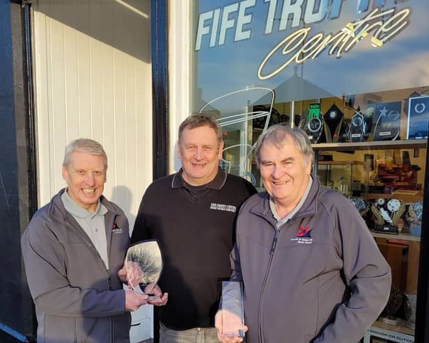 George Macdonald and Don Burns from Kirkcaldy & Central Fife Sports Council with  Fife Trophy Centre owner, Kevin Anderson (centre)