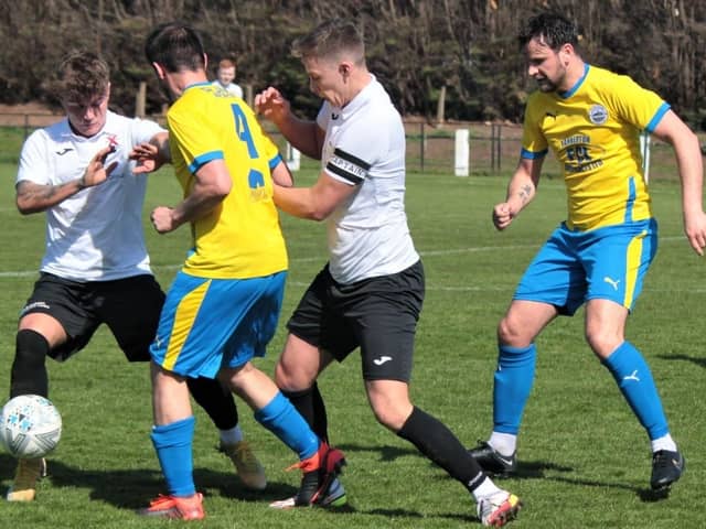 Saints battle for possession during the weekend's defeat. Pic by John Stevenson