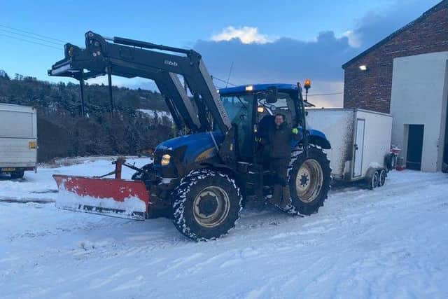 Stockman Pete Melville from The Buffalo Farm preparing to take his tractor out to ensure customers in Kirkcaldy got their order today despite the wintry weather. Pic: The Buffalo Farm.