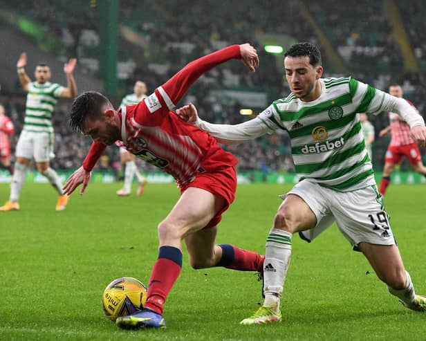Sam Stanton shields the ball from Celtic's Mikey Johnston at Parkhead on Sunday.  (Pic: Mark Runnacles/Getty Images)