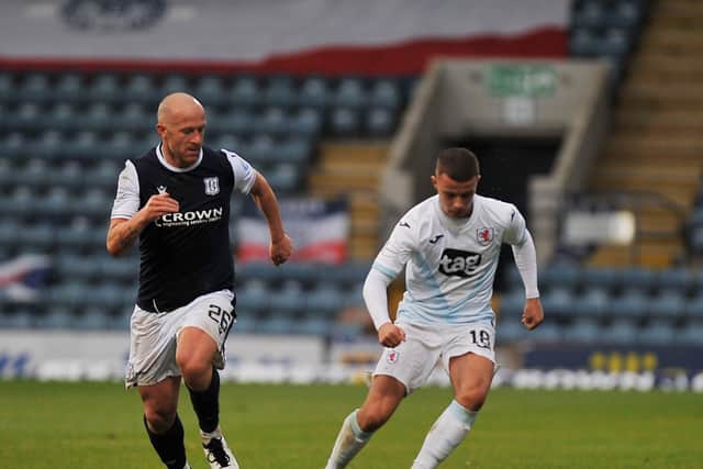 Dylan Tait is shadowed by Dundee goalscorer Charlie Adam (Pic: George McLuskie)