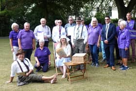 Beautiful Scotland judges Colin Ainsworth and John MacLennan with volunteers from the organisations who have worked together to help the town bloom.  Pic: Cath Ruane.