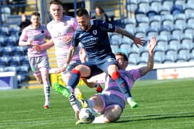 Dylan Easton being tackled from behind by Aaron Muirhead during Raith Rovers' 0-0 draw at home to Partick Thistle on Saturday (Pic: Fife Photo Agency)