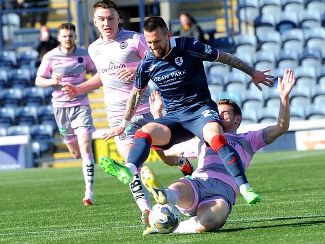 Dylan Easton being tackled from behind by Aaron Muirhead during Raith Rovers' 0-0 draw at home to Partick Thistle on Saturday (Pic: Fife Photo Agency)