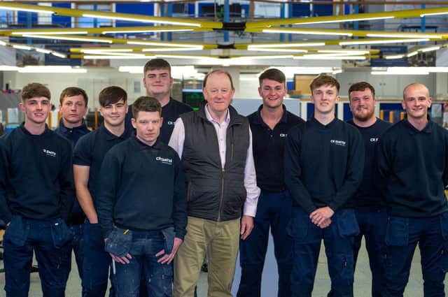 Gerard Eadie CBE with some of CR Smith's new apprentices