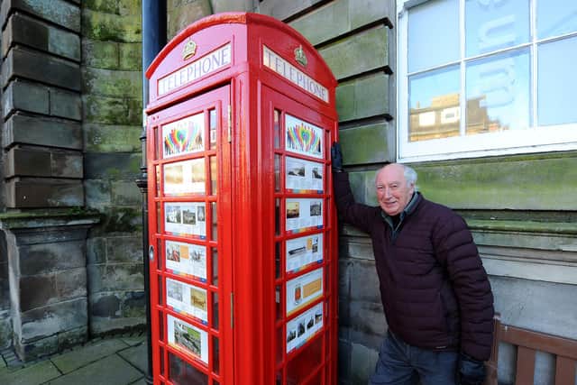 Ian Archibald from Burntisland Heritage Trust at the regenerated old red telephone box outside the library on the High Street. Pic: Fife Photo Agency