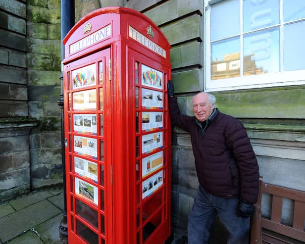 Ian Archibald from Burntisland Heritage Trust at the regenerated old red telephone box outside the library on the High Street. Pic: Fife Photo Agency