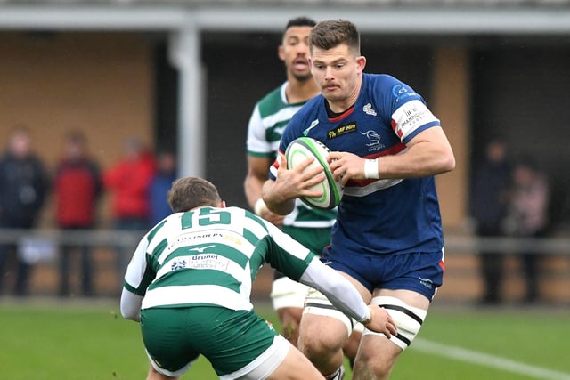 Doncaster captain Sam Graham looks to avoid the tackle from Ealing’s David Johnston.