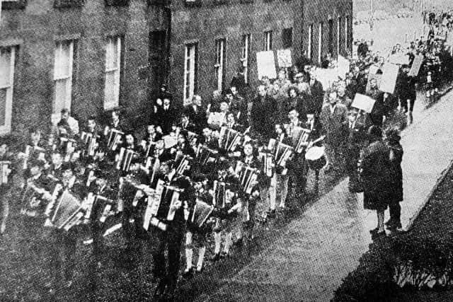 Miners march through Kirkcaldy to the Adam Smith Hall