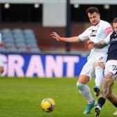 Kyle Benedictus challenges with Dundee’s Jason Cummings.