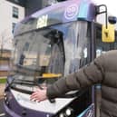 A passenger waits to board a 'driverless' bus