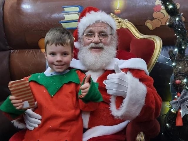 Little elf Billy Dawes and Santa brought some Christmas magic to the festivities
