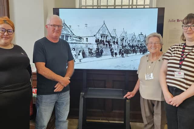 From left, Rachel-Jane Morrison, OnFife Community Impact Manager, Gordon Sutherland and Mary Reilly, both from Friends of Methil Heritage Centre, and Hannah Draper, Museum Assistant. In the background is Methil Public School, which used to be on High Street - opposite the heritage centre - built in 1893, closed in 1969 and demolished in 1972. (Pic: OnFife)