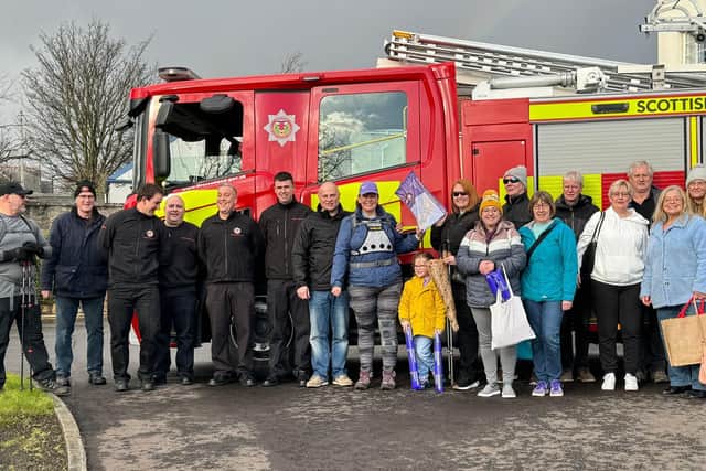 Lisa Foster with family, friends and members of Kirkcaldy's Red Watch at the end of her 300 mile challenge.  (Pic: submitted)