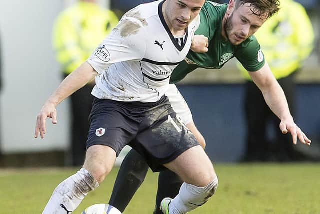 Raith Rovers' Lewis Vaughan holding off Keith Watson, then at Hibernian, at Kirkcaldy's Stark's Park in March 2015 (Pic: Bill Murray/SNS Group)