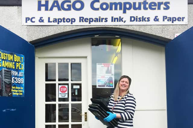Sandra Smith, a teacher at Glenrothes High School, collecting some of the donated laptops
