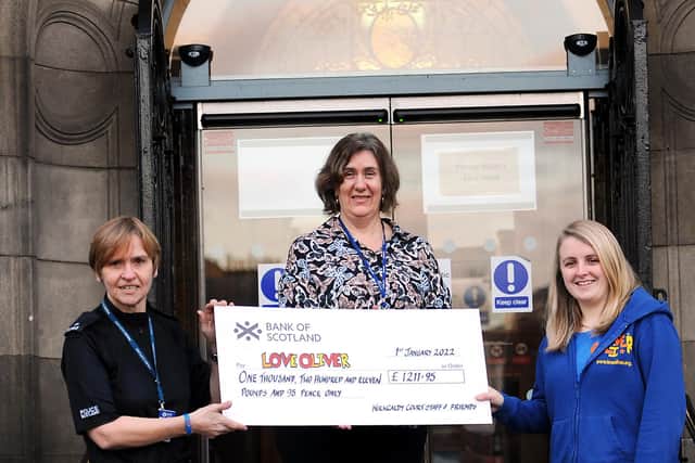 Pictured from left are: PC Pam Hay and Christine Martin who presented Jennifer Gill from Love Oliver with a cheque for £1,211.95. Pic: Fife Photo Agency