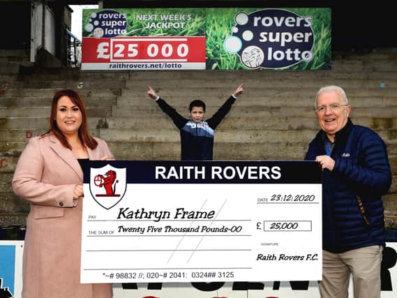 Super Lotto winner Kathryn Frame with son Cooper and Tom Morgan