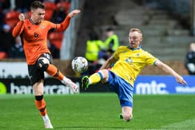 Now frozen out Raith Rovers star Ross Millen tackles Dundee United's Glenn Middleton during Raith's 1-0 win at Tannadice on December 16 (Pic Sammy Turner/SNS Group)