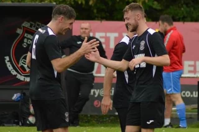 The YM’s Kieran Dall is congratulated on his goals​