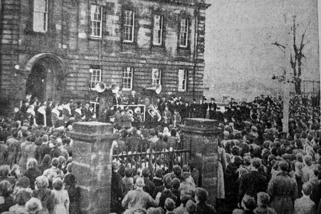 Crowds gather outside police headquarters in Kirkcaldy to hear the proclamation