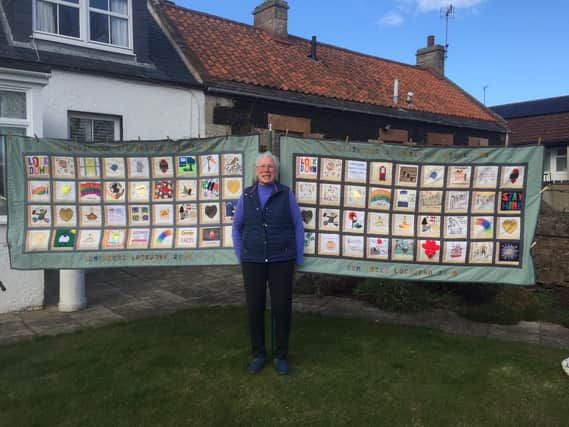 Elizabeth with the quilts.