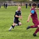 Blair Hardie in the thick of the action for Cupar. By Hayley McHugh